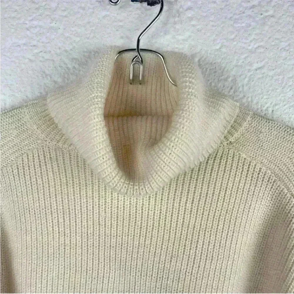 COS Roll neck sweater in white and black striped wool and cotton blend